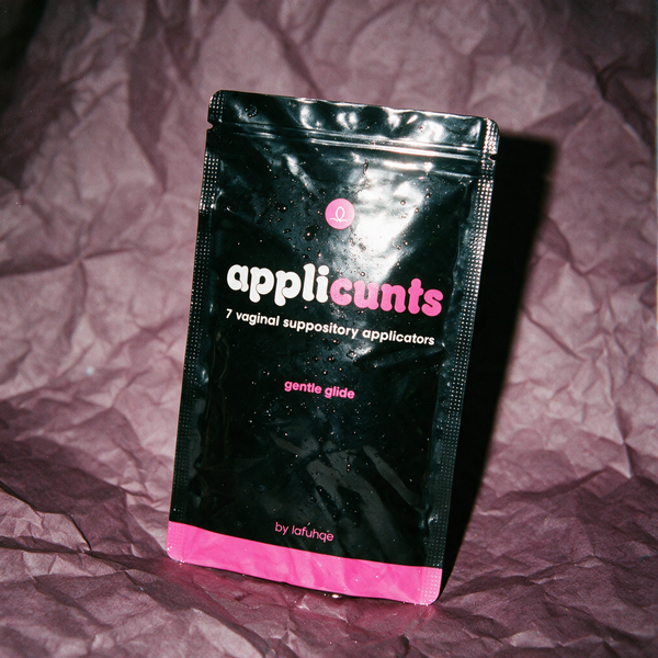 Applicunts suppository applicators pouch on dark mauve plum backdrop