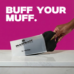 Hand holding a black muff buffer with packaging labeled 'muffbuff' against a pink background.